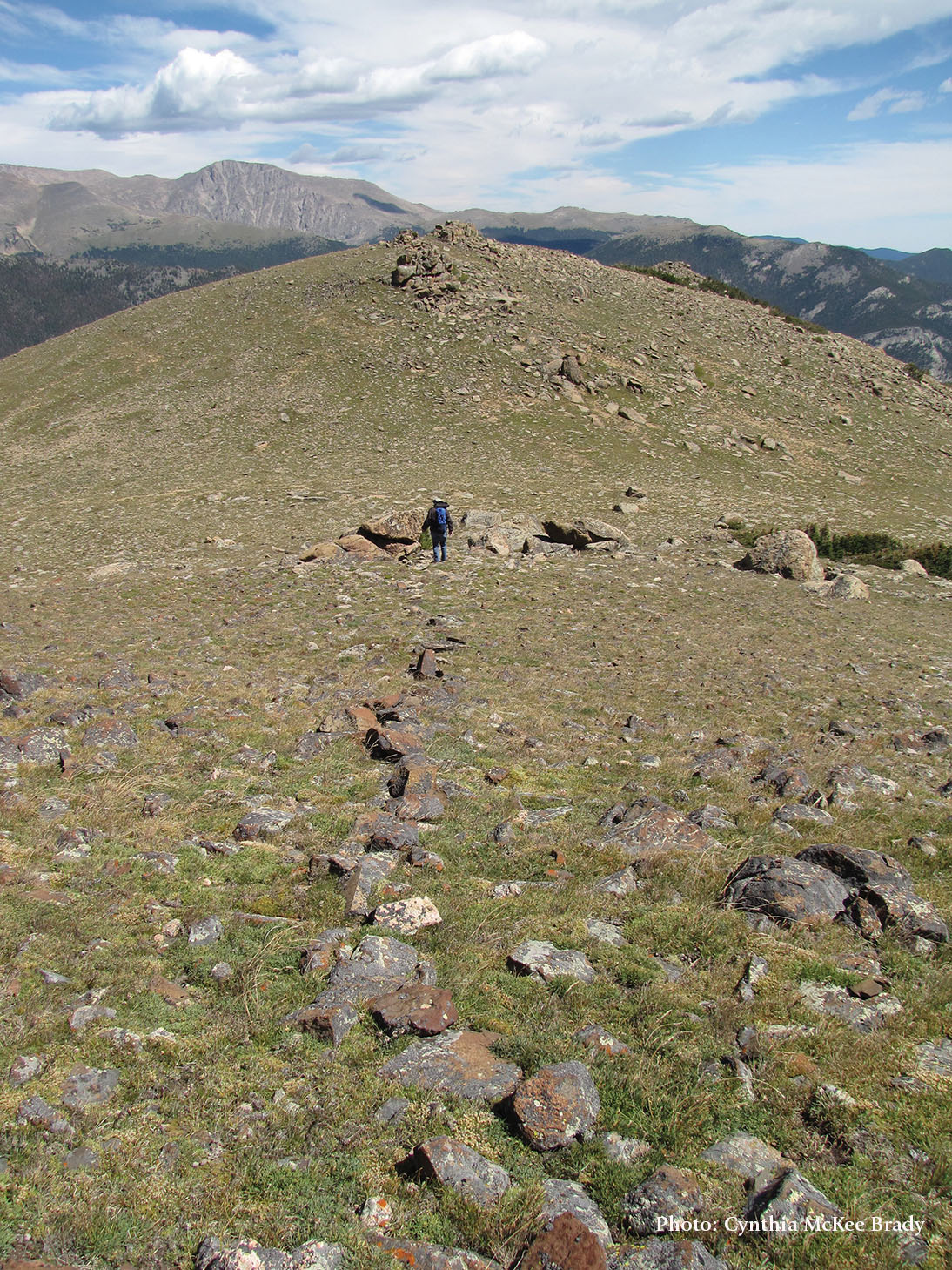 Man traversing a hill