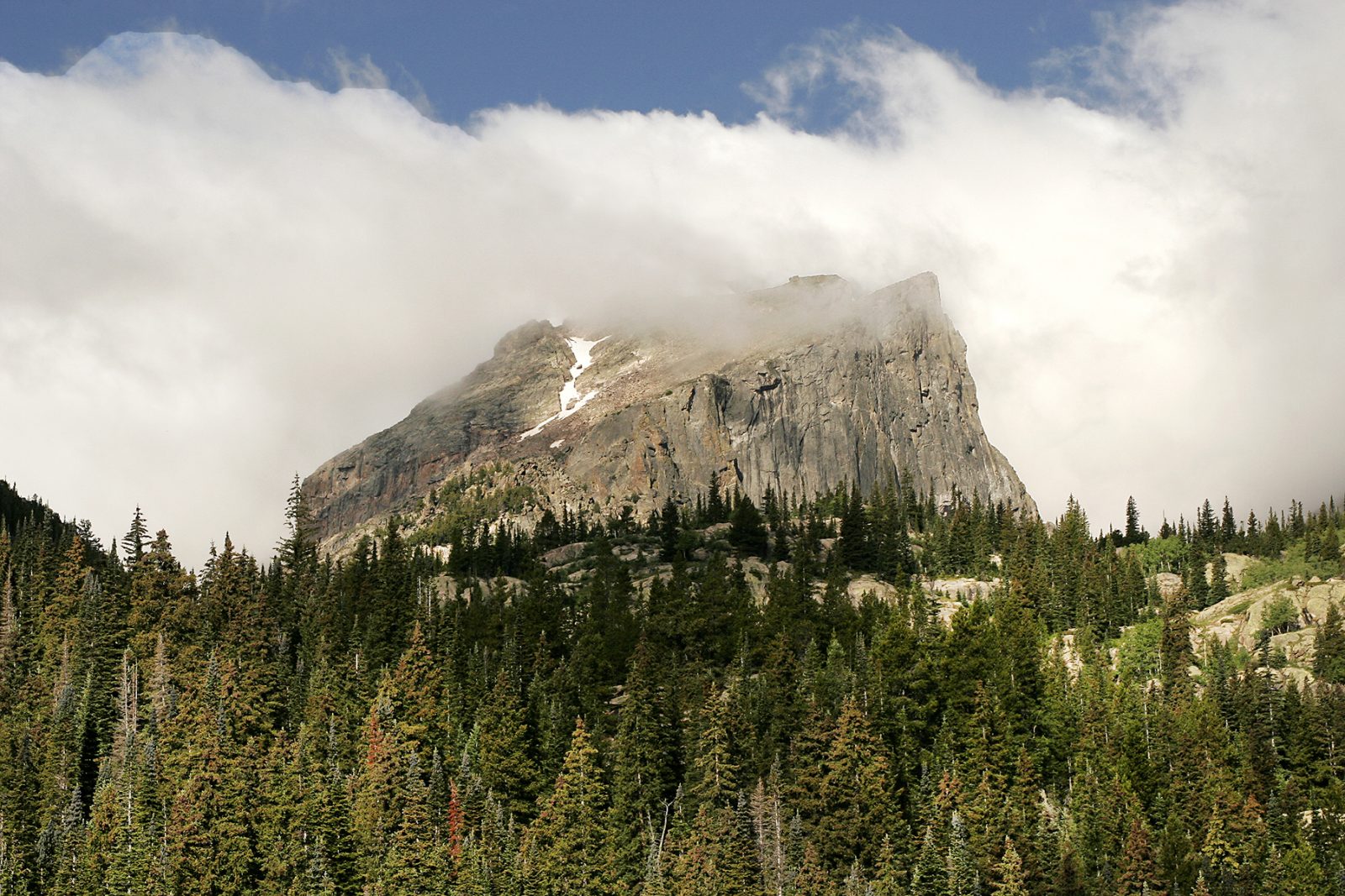 A mountain covered in clouds.